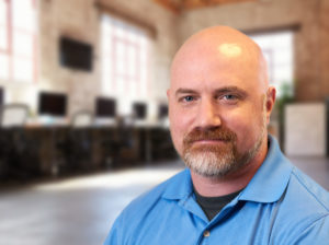 Todd - portrait of man with beard and blue polo